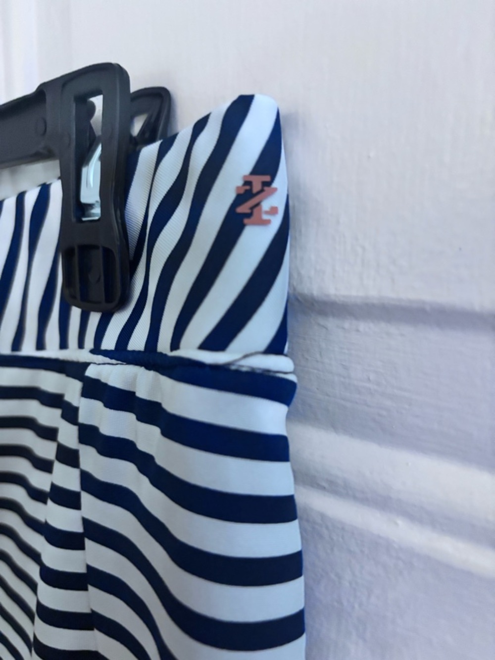 Izod Navy and White Striped Golf Skort with Pleated Flounce - Picture 3 of 6